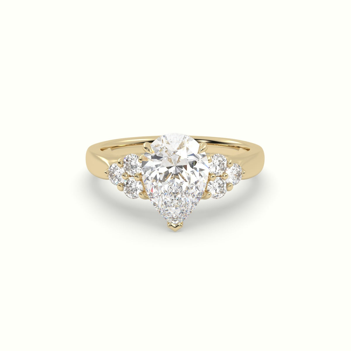 Pear Cut Diamond Side Stone Engagement Ring — Yellow Gold