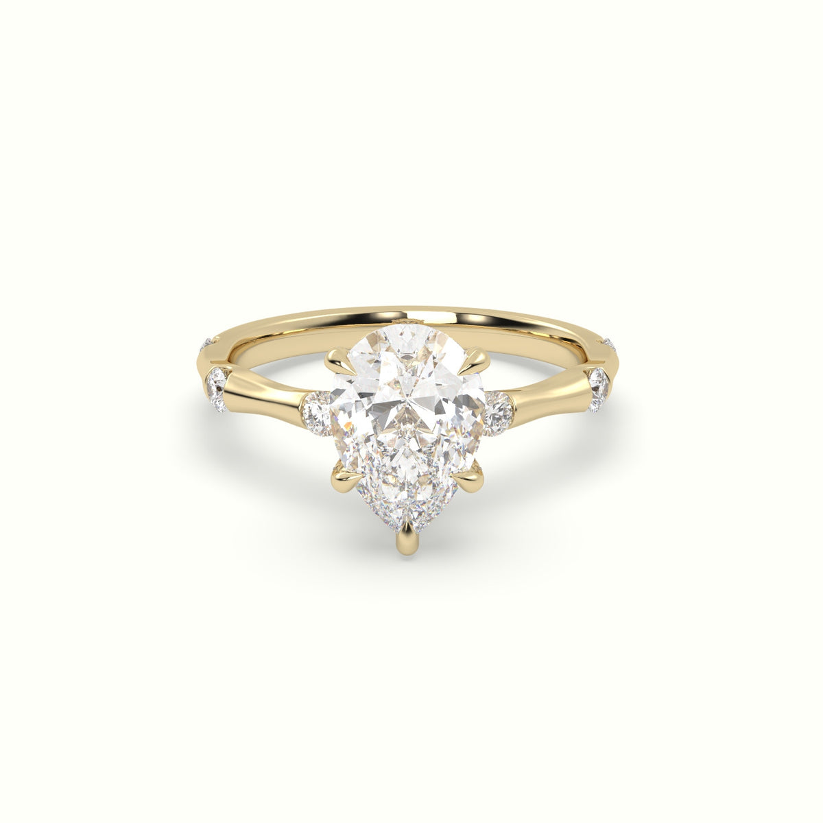 Pear Diamond Side Stone Engagement Ring — Yellow Gold