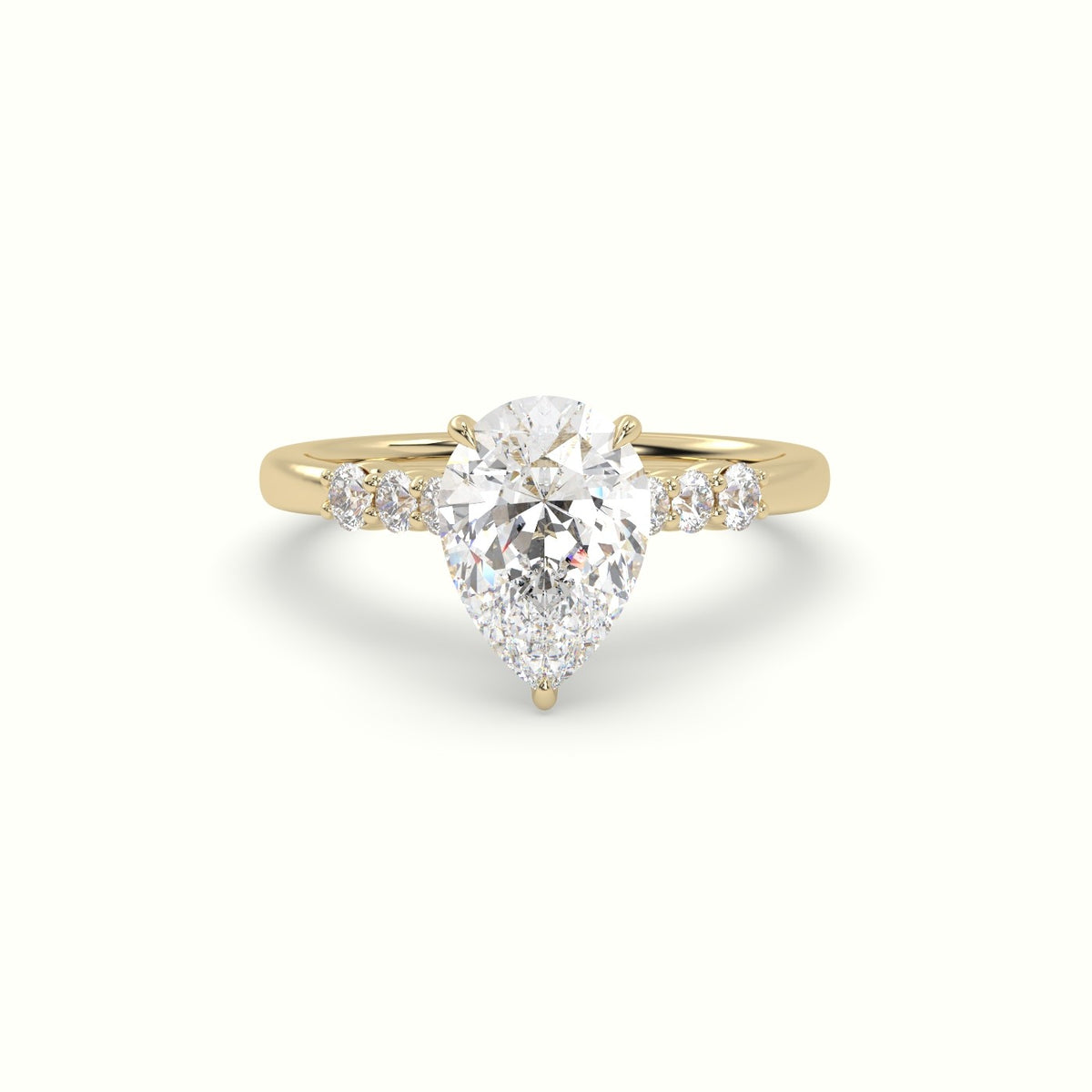 Pear Cut Diamond Engagement Ring With Side Stones — Yellow Gold