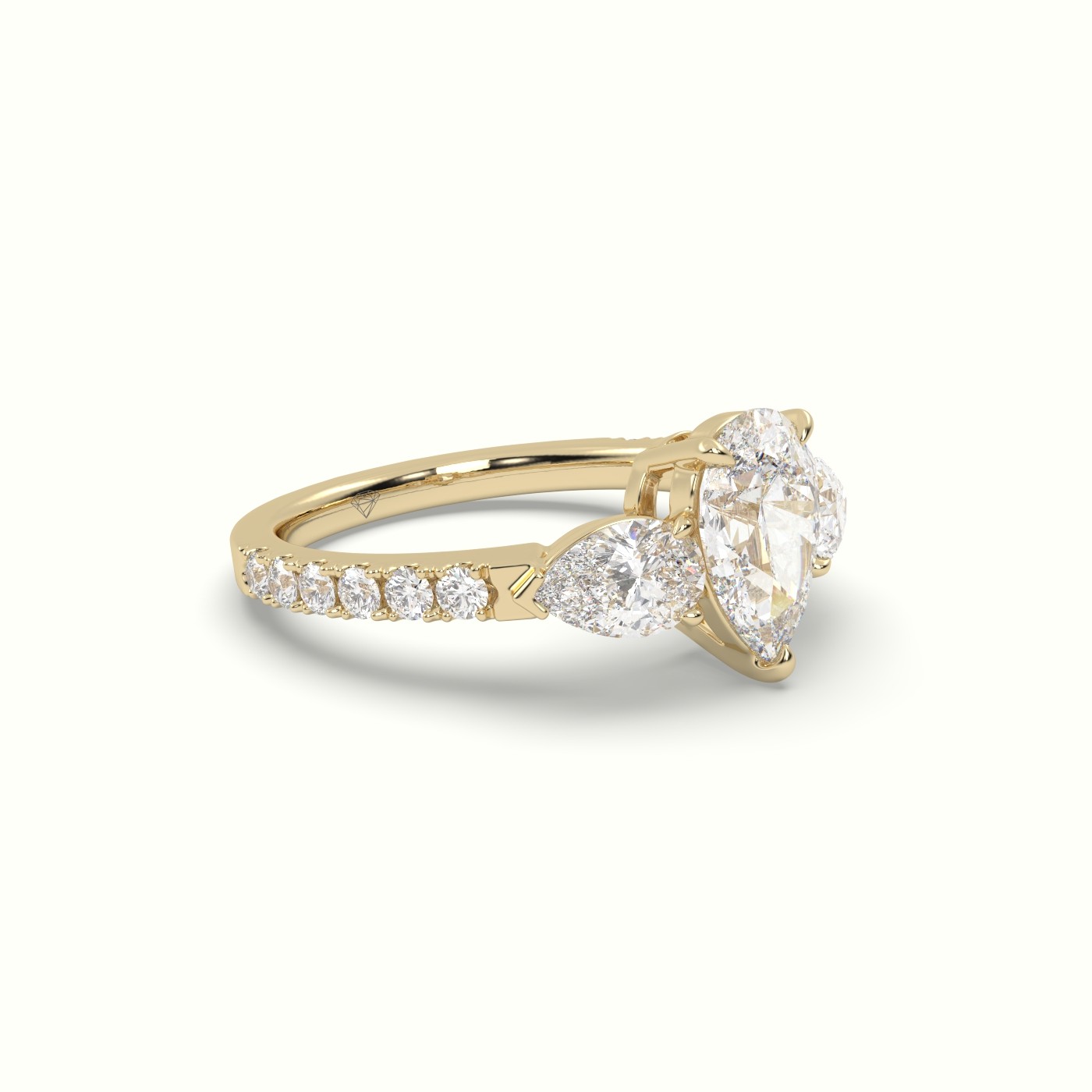 10K YELLOW GOLD PEAR-SHAPED TRILOGY DIAMOND RING