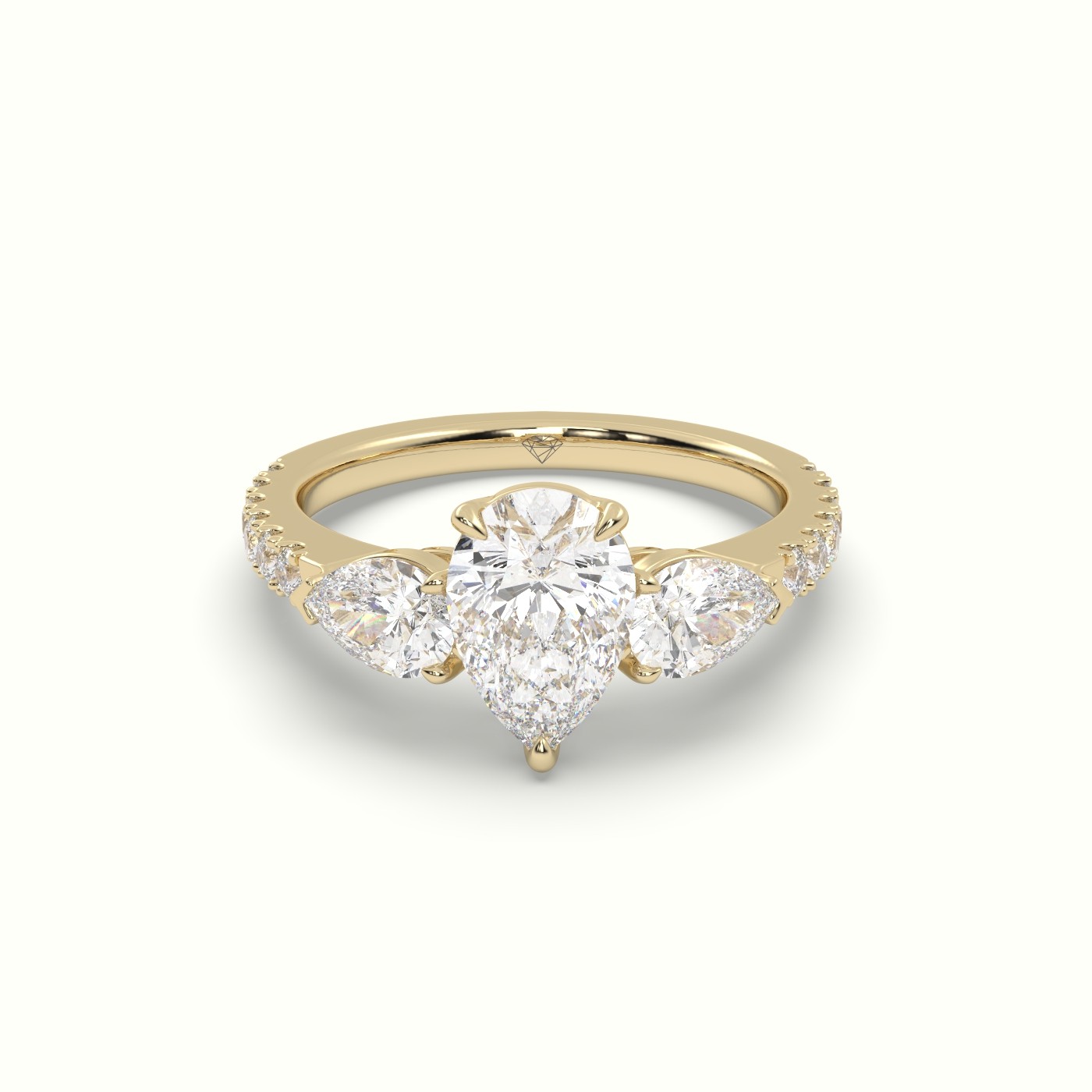 10K YELLOW GOLD PEAR-SHAPED TRILOGY DIAMOND RING