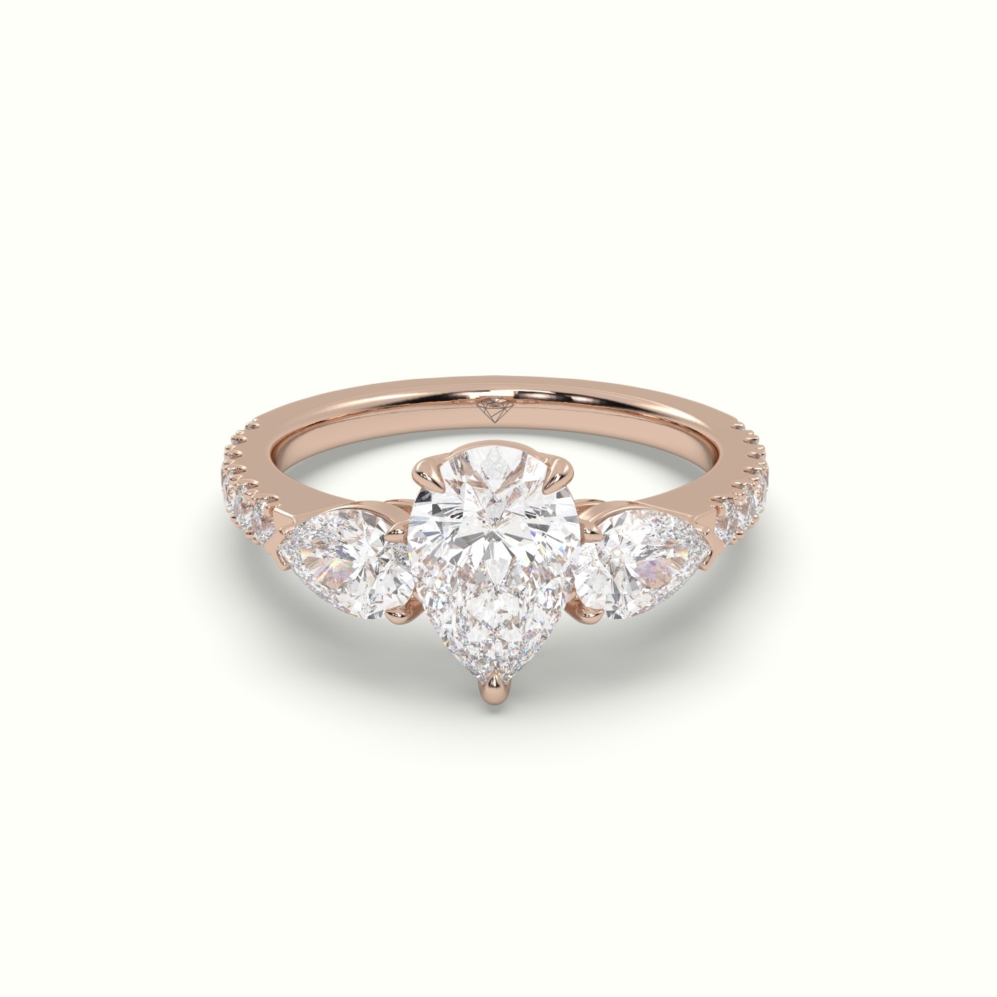 10K ROSE GOLD PEAR-SHAPED TRILOGY DIAMOND RING
